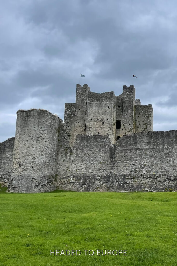 The medieval Trim Castle standing tall under a dramatic cloudy sky, offering a historic experience for Weekend Breaks in Ireland.